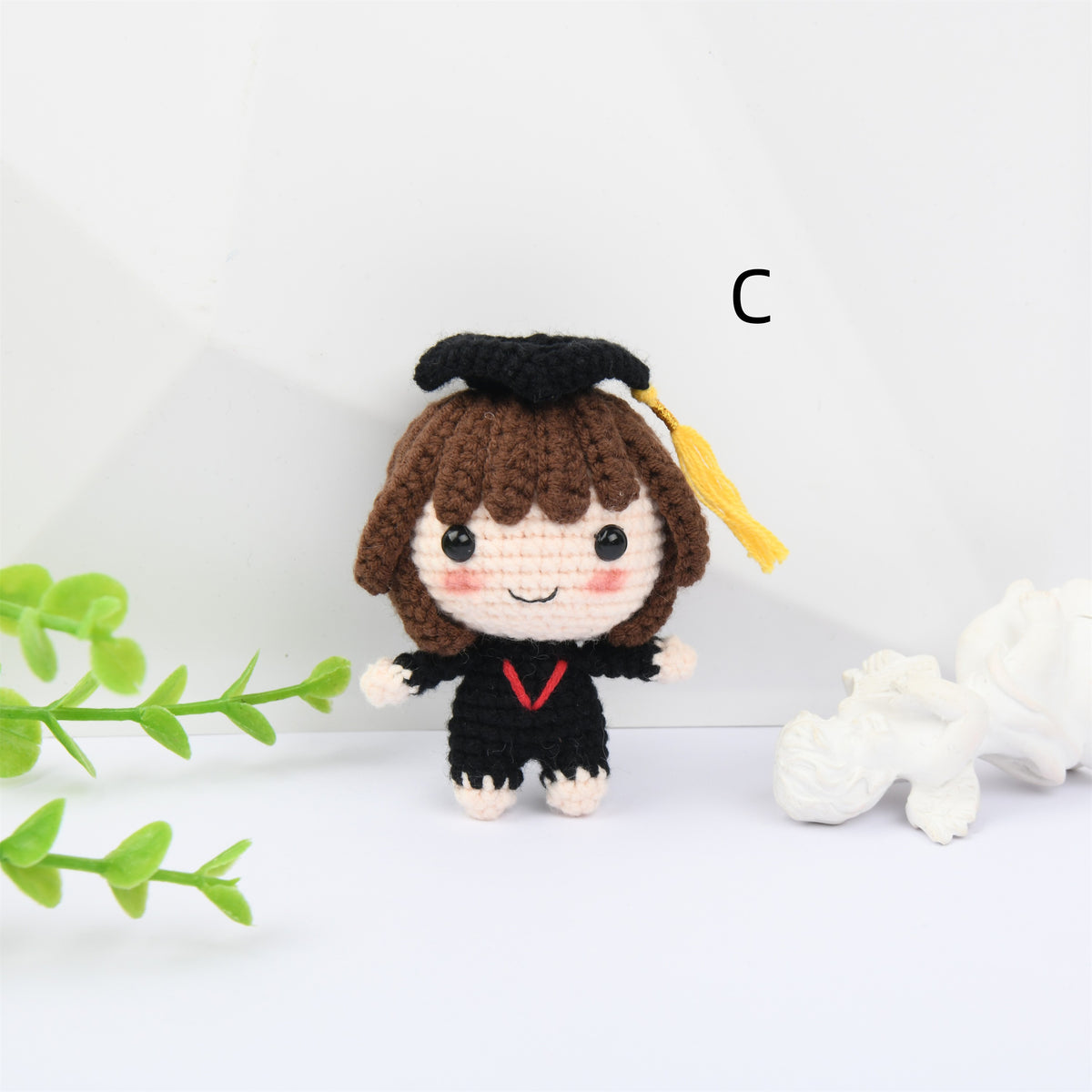 Crochet Graduation doll with blush and a mortarboard