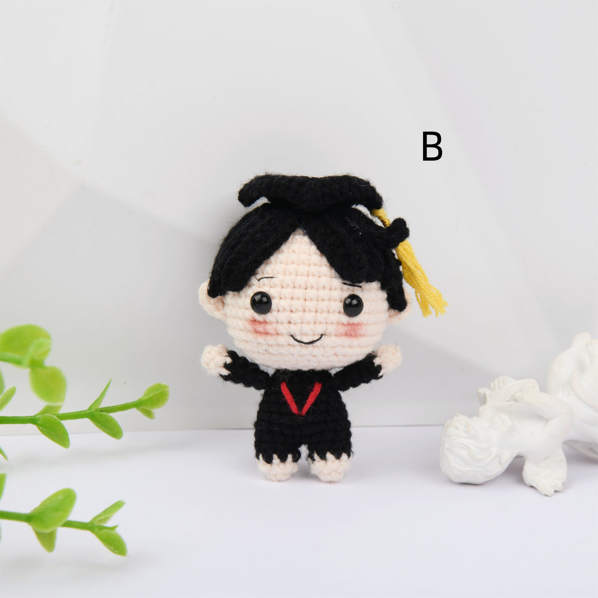 Crochet Graduation doll with blush and a mortarboard