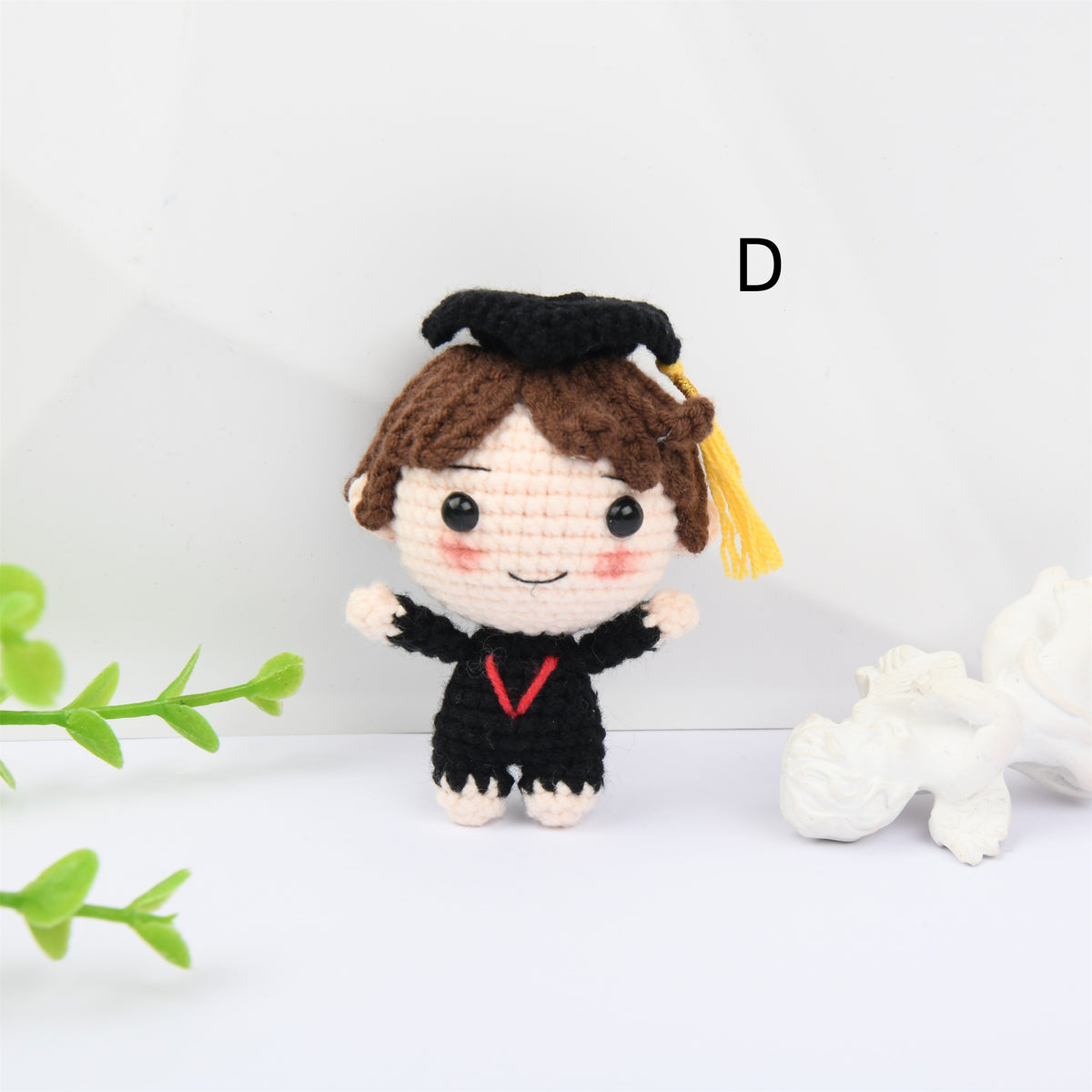 Crochet Graduation doll with blush and a mortarboard