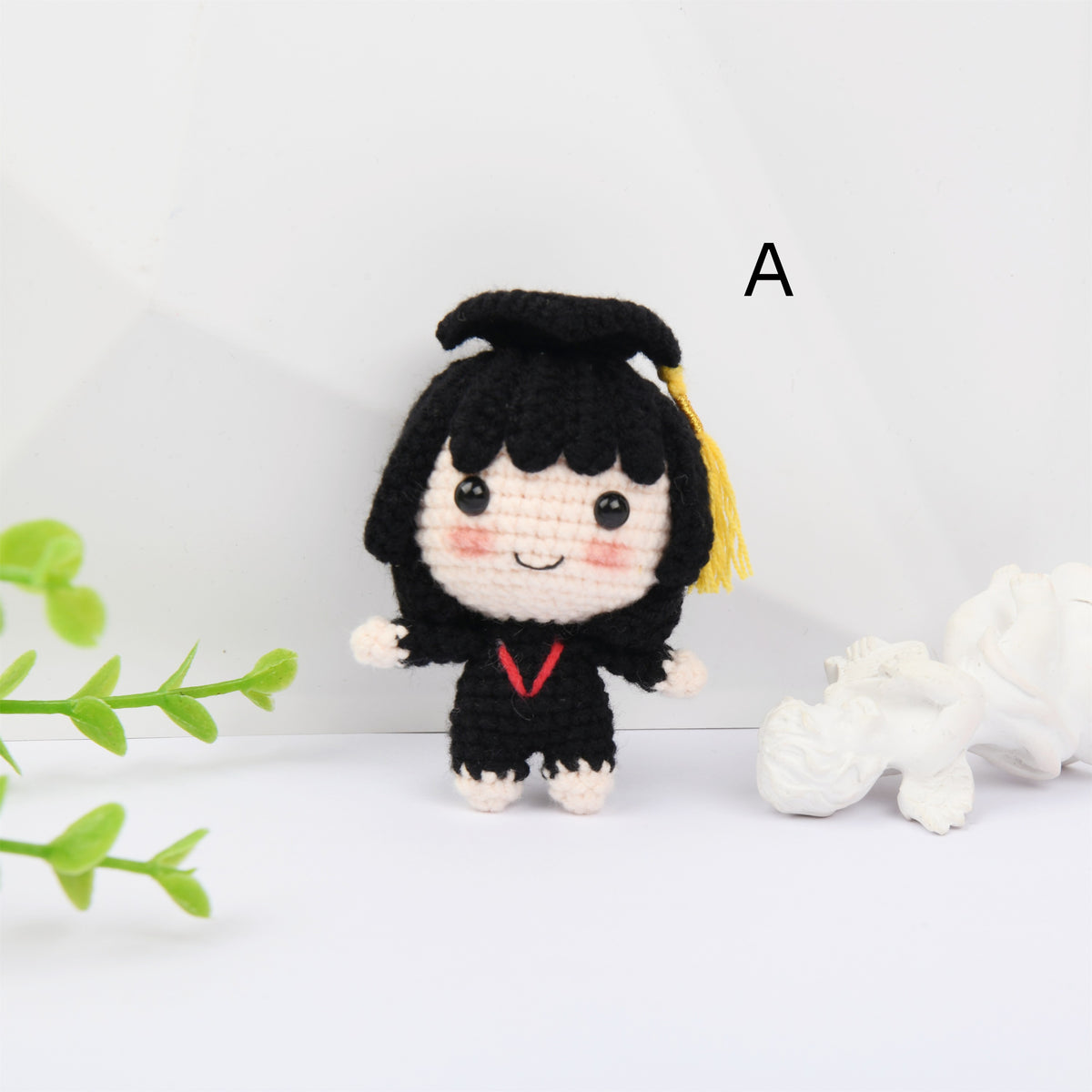Crochet Graduation doll with blush and a mortarboard